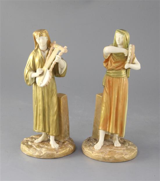 A pair of Royal Worcester Egyptian musicians by James Hadley, c.1891, height 22.5cm